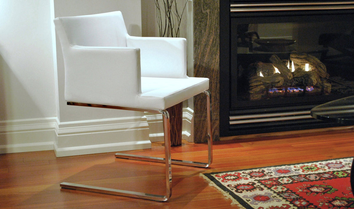 Soho Flat Dining Arm Chair by SohoConcept, showing angle view of flat arm chair in live shot.