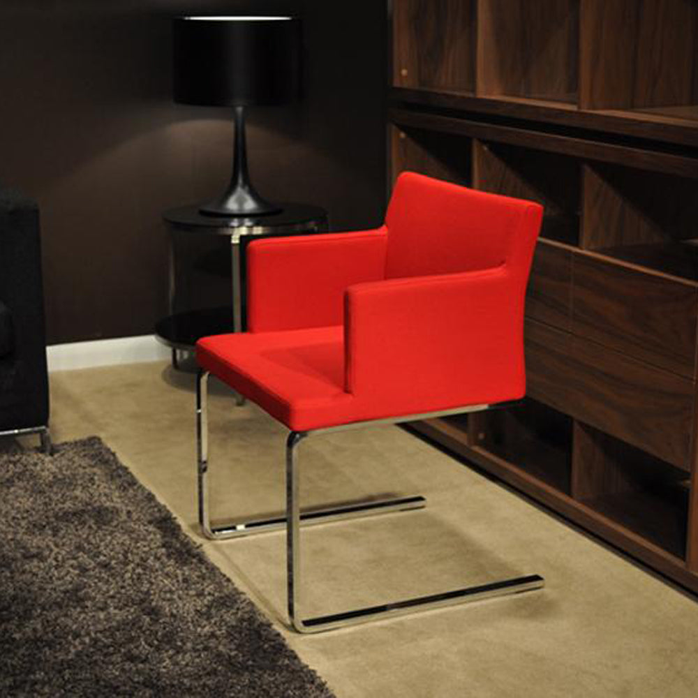 Soho Flat Dining Arm Chair by SohoConcept, showing angle view of flat arm chair in live shot.