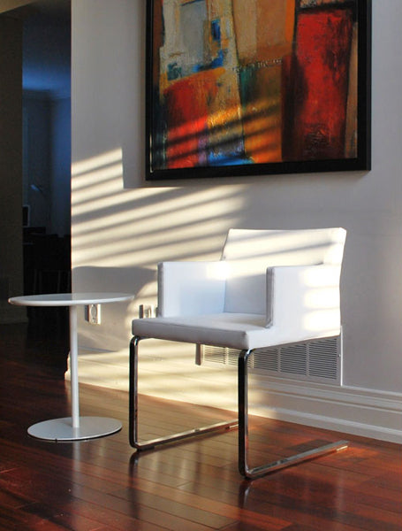 Soho Flat Lounge Arm Chair by SohoConcept, showing flat lounge arm chair with table in live shot.