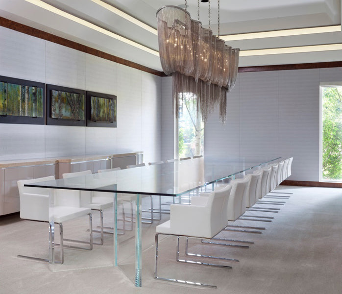 Soho Flat Lounge Arm Chair by SohoConcept, showing flat lounge arm chairs with table in live shot.