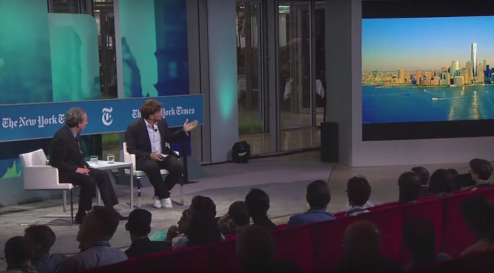 Soho Flat Lounge Arm Chair by SohoConcept, showing flat lounge arm chairs with table in live shot.
