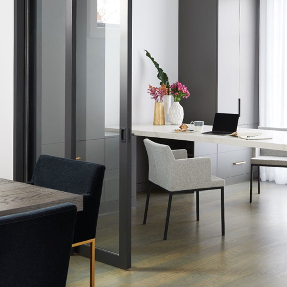 Soho Metal Arm Chair by SohoConcept, showing metal arm chair with table in live shot.