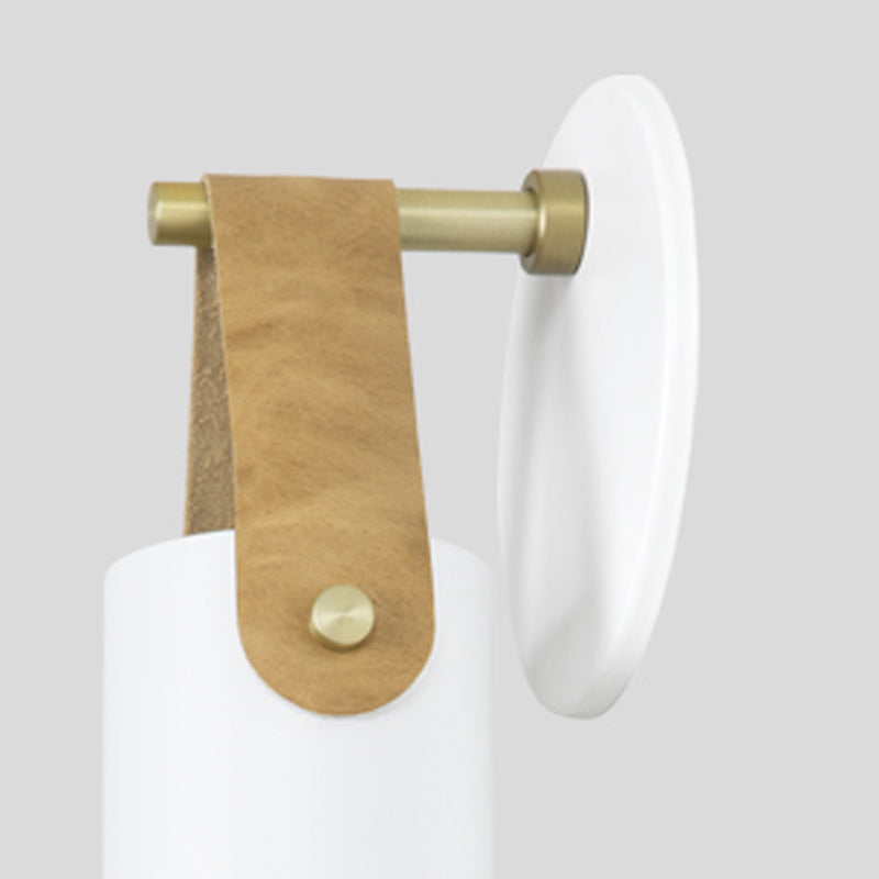 Spero Sconce by Cerno, showing closeup view of spero sconce in white/tan leather.