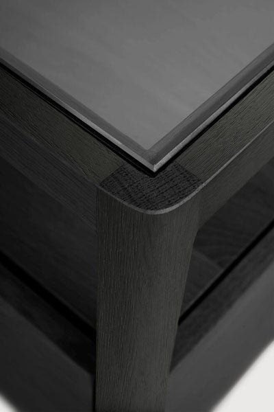 Spindle Bedside Table by Ethnicraft, showing closeup view of spindle bedside table in black oak wood.