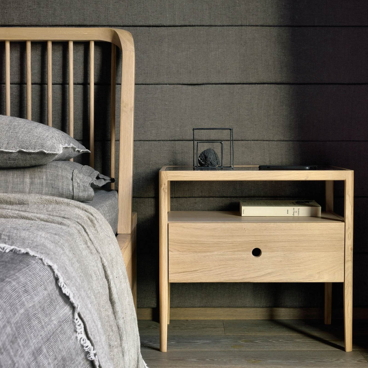Spindle Bed with Slats by Ethnicraft, showing front view of bed with slats in live shot.