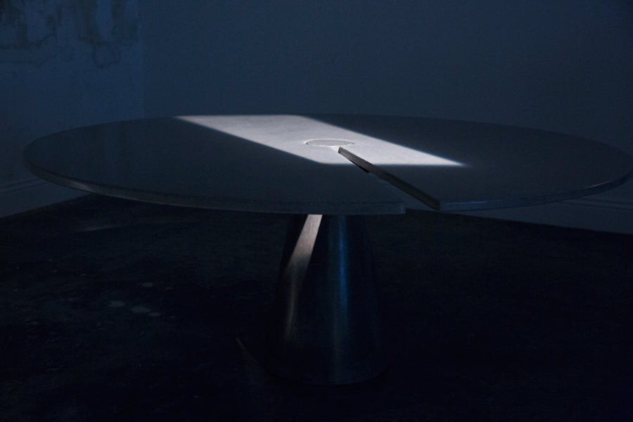 James De Wulf Split Locking Round Dining Table by De Wulf, showing split locking round dining table in live shot.