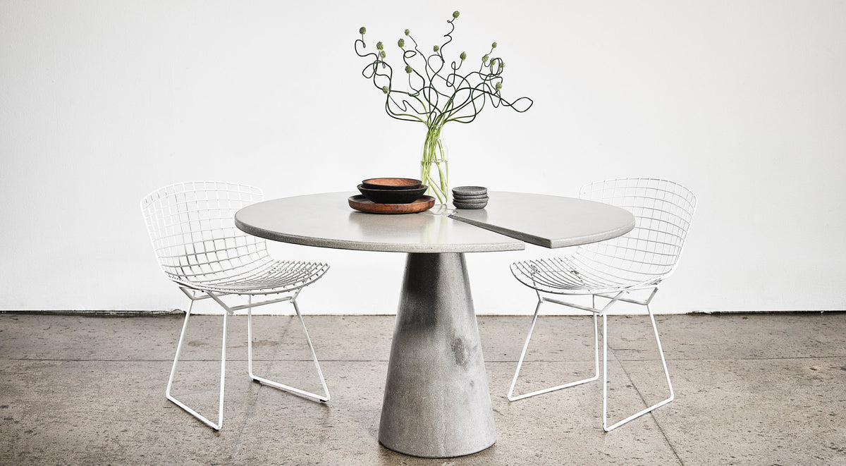 James De Wulf Split Locking Round Dining Table by De Wulf, showing split locking round dining table with chairs in live shot.