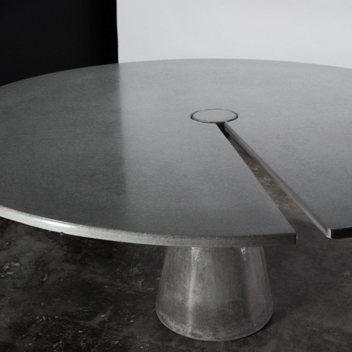 James De Wulf Split Locking Round Dining Table by De Wulf, showing closeup view of split locking round dining table in live shot.