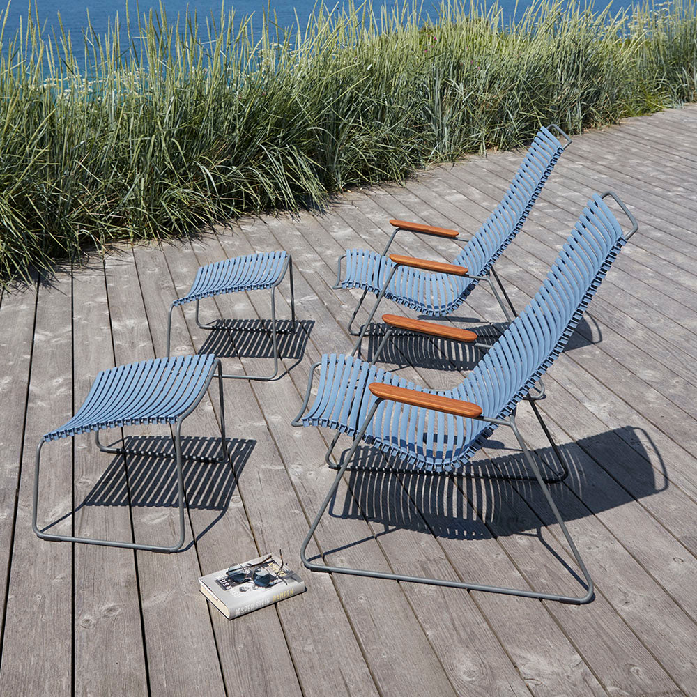 Click Footrest by Houe, showing click footrest with lounge chair in live shot.