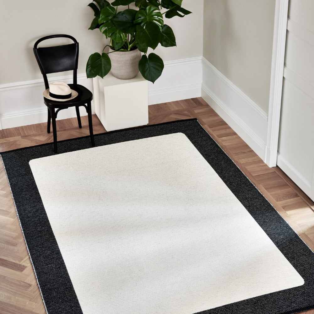 Ilda Black & Vanilla Runner Rug by Pappelina, showing ilda black & vanilla runner rug in live shot.
