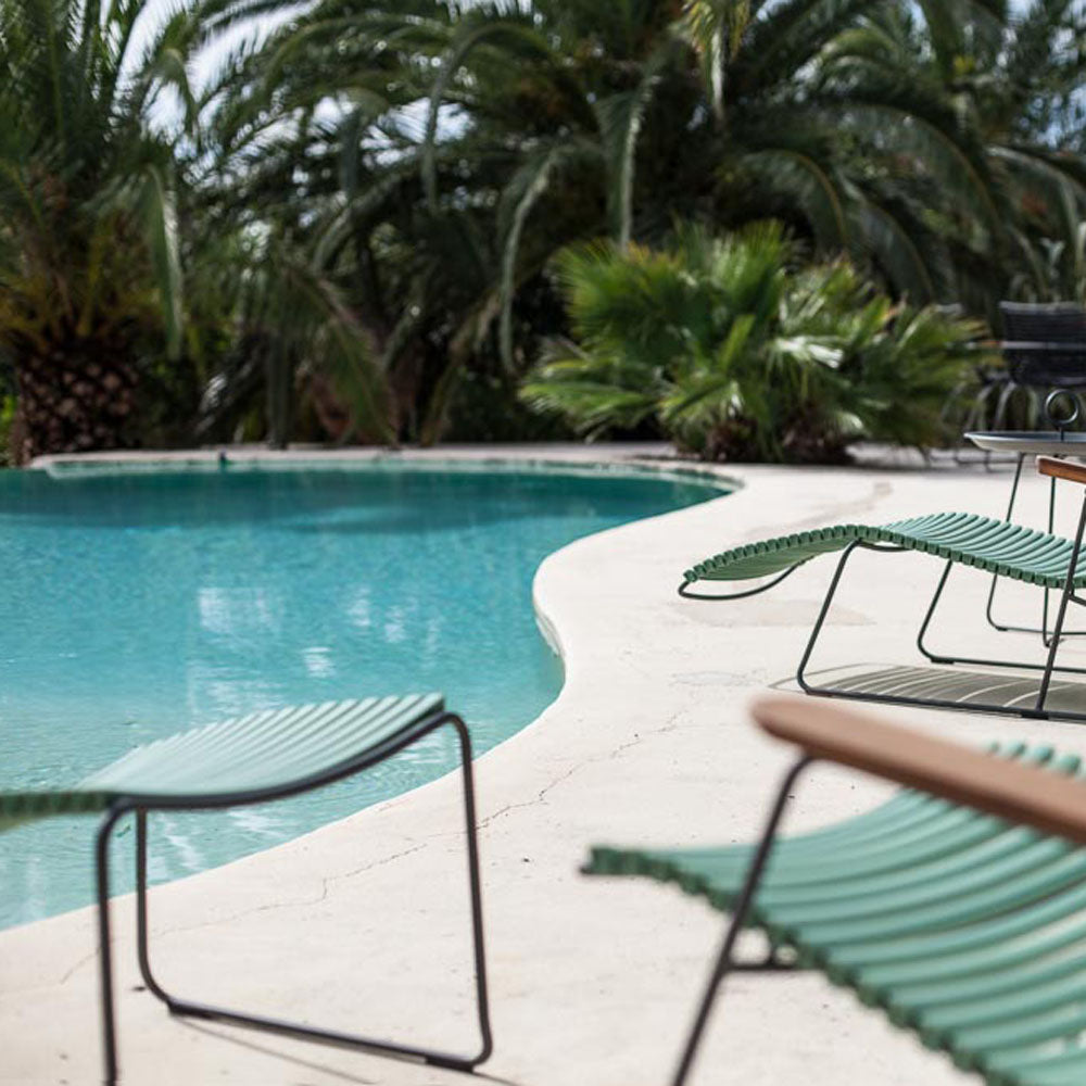 Click Footrest by Houe, showing click footrest with lounge chair in live shot.