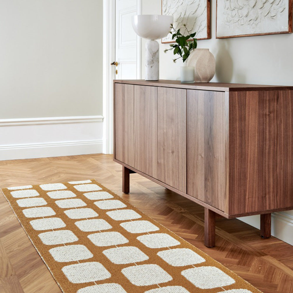 Sten Ochre & Vanilla Runner Rug by Pappelina, showing sten ochre & vanilla runner rug in live shot.
