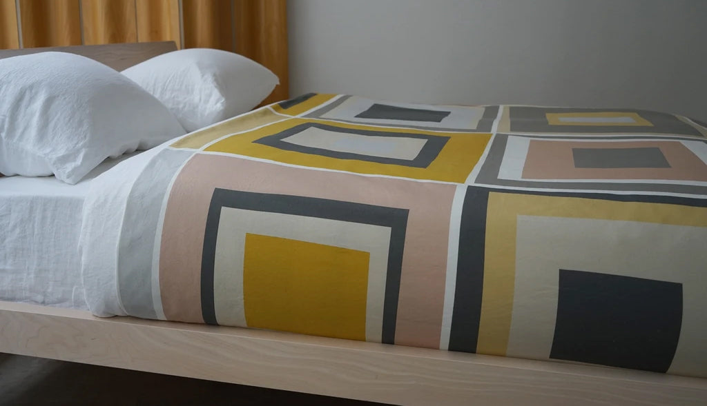 Squares Cotton Bed Cover by Area, showing squares cotton bed cover in room shot.