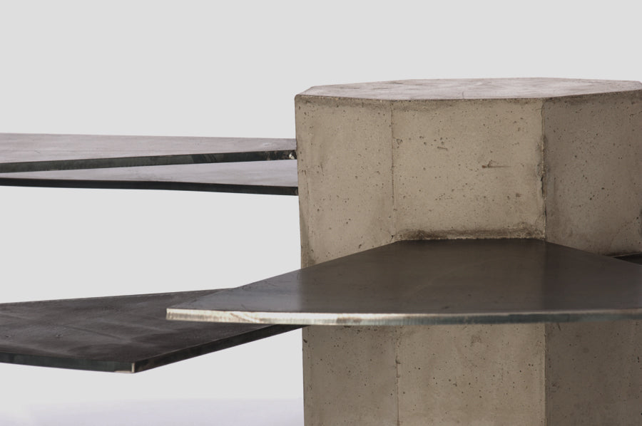 James De Wulf Steel Fan Coffee Table by De Wulf, showing closeup view of steel fan coffee table in natural tone concrete/steel plates.
