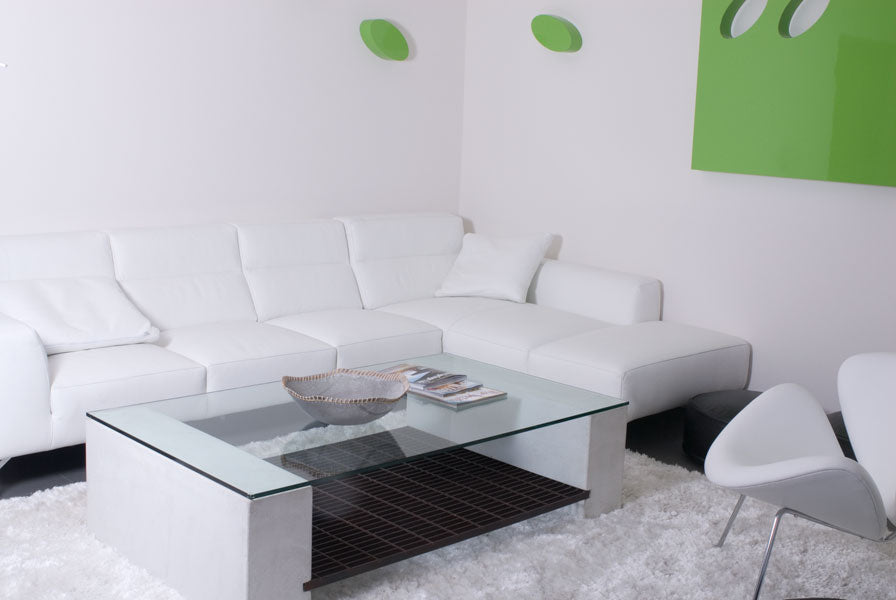 James De Wulf Steel Grating Coffee Table by De Wulf, showing steel grating coffee table with sectional sofa in live shot.