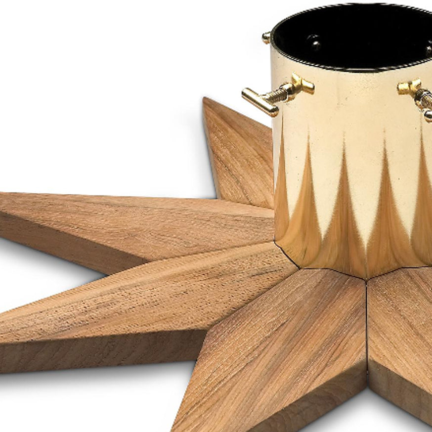 Stella Christmas Tree Base by Skagerak, showing closeup view of stella christmas tree base in teak/brass plated steel.