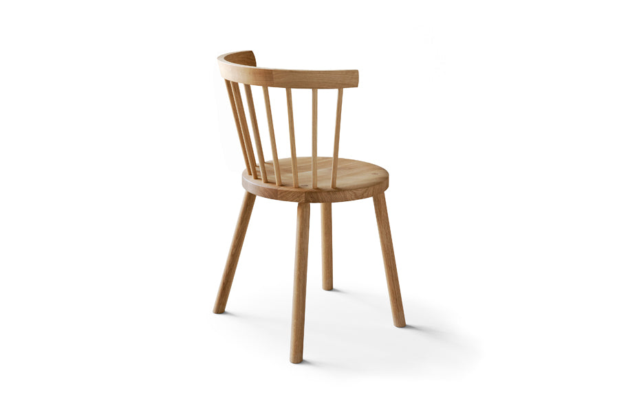 Storia KVT10 Chair by Nikari, showing back view of storia kvt10 chair in lacquer oak.