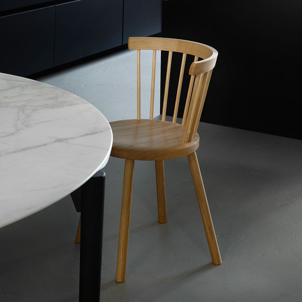 Storia KVT10 Chair by Nikari, showing storia kvt10 chair with table in live shot.