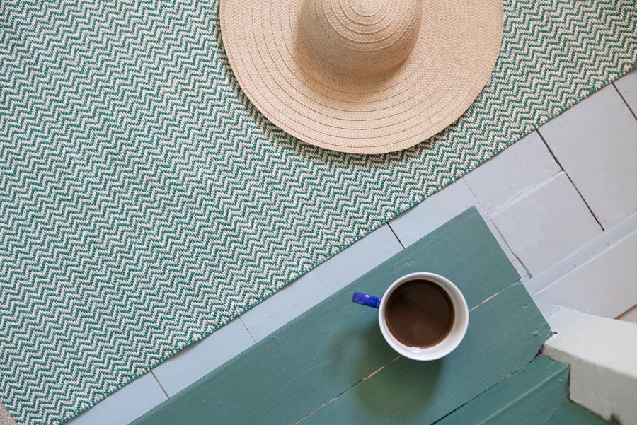 Strand Woven Plastic Rug by Brita, showing closeup up view strand woven plastic rug in live shot.