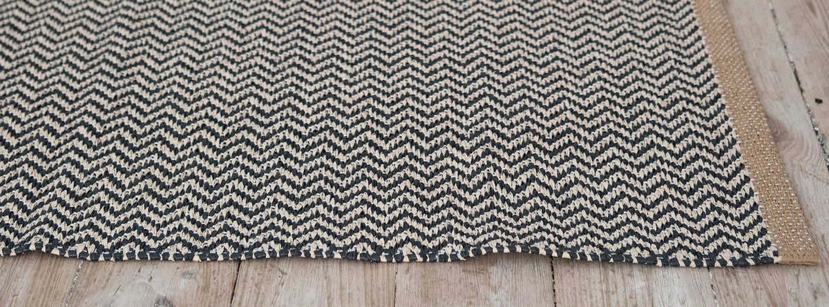 Strand Woven Plastic Rug by Brita, showing strand woven plastic rug in live shot.