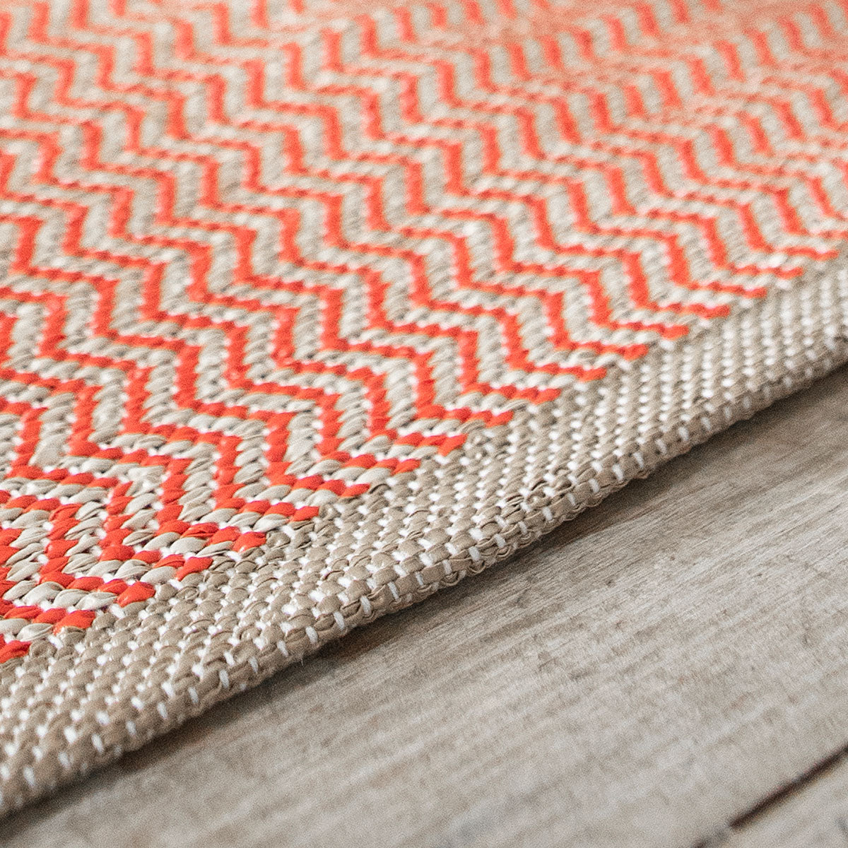 Strand Woven Plastic Rug by Brita, showing strand woven plastic rug in live shot.