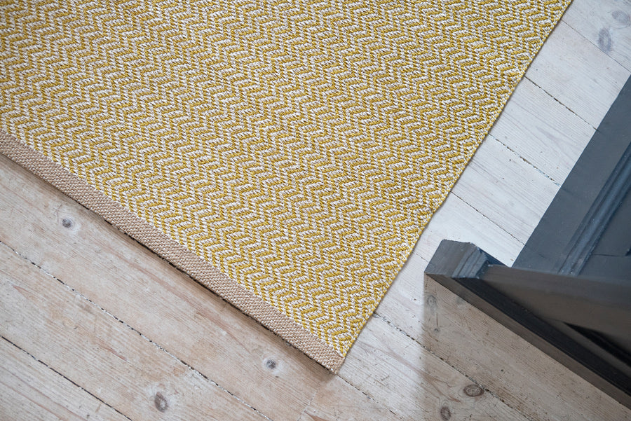 Strand Woven Plastic Rug by Brita, showing closeup view of strand woven plastic rug in live shot.