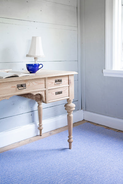 Strand Woven Plastic Rug by Brita, showing strand woven plastic rug in live shot.