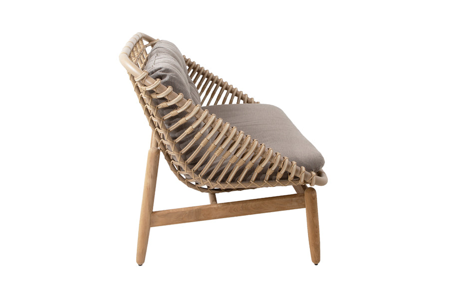 Strington Outdoor Teak 2-Seater Sofa by Cane-Line, showing side view of strington outdoor teak 2-seater sofa in natural weave/taupe airtouch cushion set.