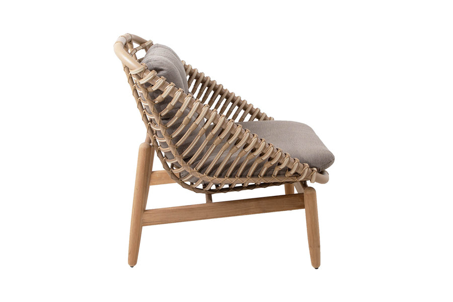 Strington Outdoor Teak Lounge Chair by Cane-Line, showing side view of strington outdoor teak lounge chair in natural weave/taupe airtouch cushion set.
