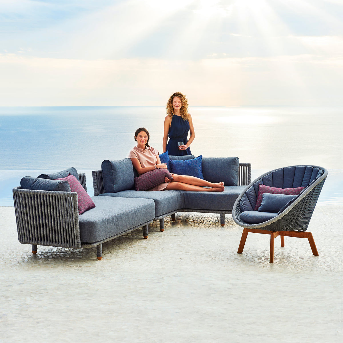 Stripe Scatter Cushion by Cane-Line, showing stripe scatter cushions in live shot.