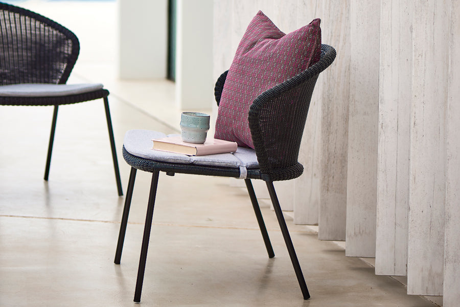 Stripe Scatter Cushion by Cane-Line, showing stripe scatter cushion in live shot.