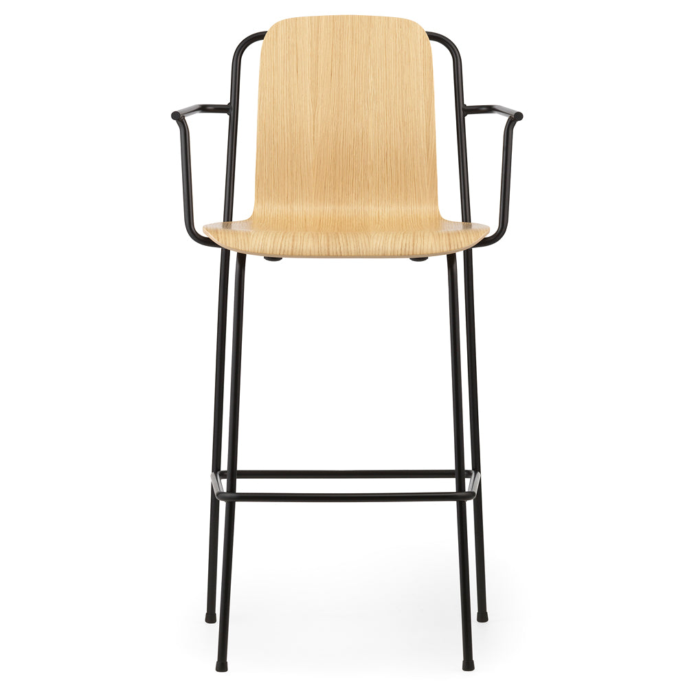 Studio Bar Armchair by Normann Copenhagen, showing front view of studio bar armchair in 45" high/oak lacquered veneer wood shell.