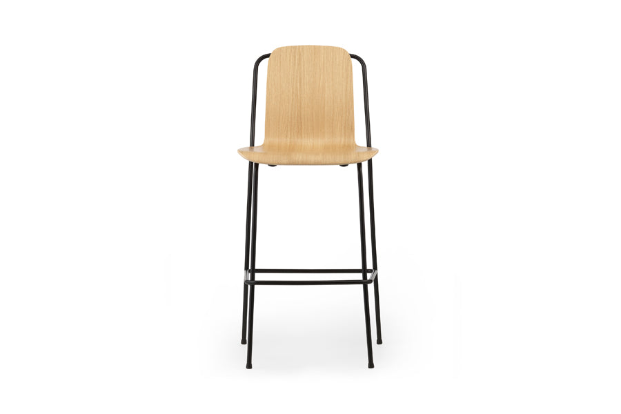 Studio Bar Chair by Normann Copenhagen, showing front view of studio bar chair in 45" high/oak lacquered veneer wood shell.