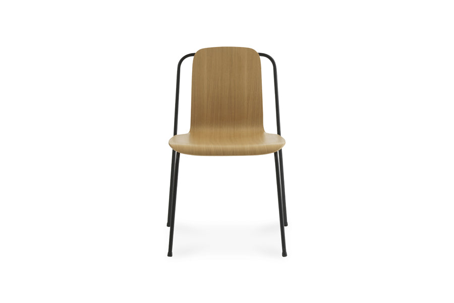 Studio Chair by Normann Copenhagen, showing front view of studio chair in oak lacquered veneer wood shell.