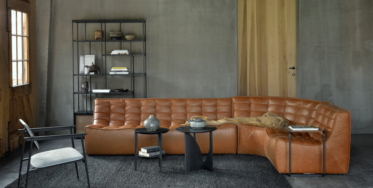 Studio Rack by Ethnicraft, showing front view of teak rack 2 sliding doors and sofa in live shot.