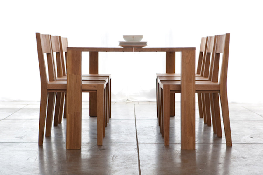 LAX Edge Dining Table by MASHstudios, showing side view of the dining set.
