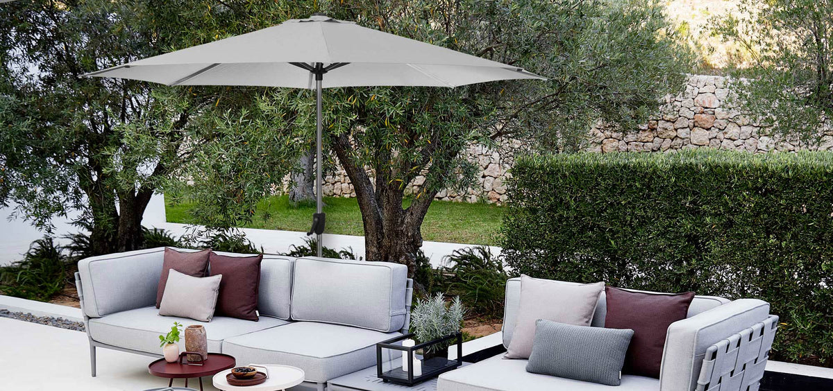 Sunshade Parasol by Cane-Line, showing sunshade parasol in live shot.