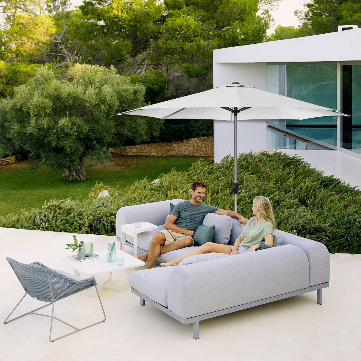 Sunshade Parasol by Cane-Line, showing sunshade parasol in live shot.