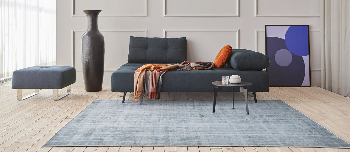 Supremax/Cassius D.E.L. Ottoman by Innovation, showing supremax/cassius d.e.l. ottoman with sofa bed & table in live shot.