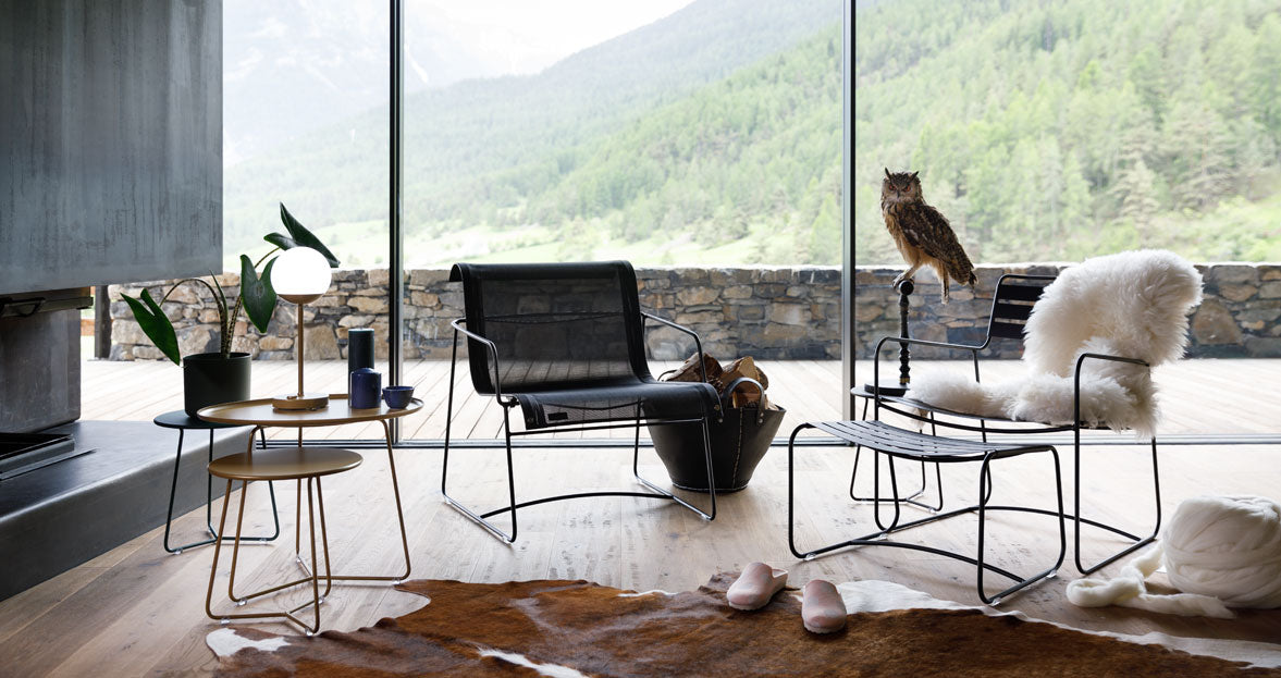 Surprising Low Armchair by Fermob, showing angle view of armchair in the live shot.