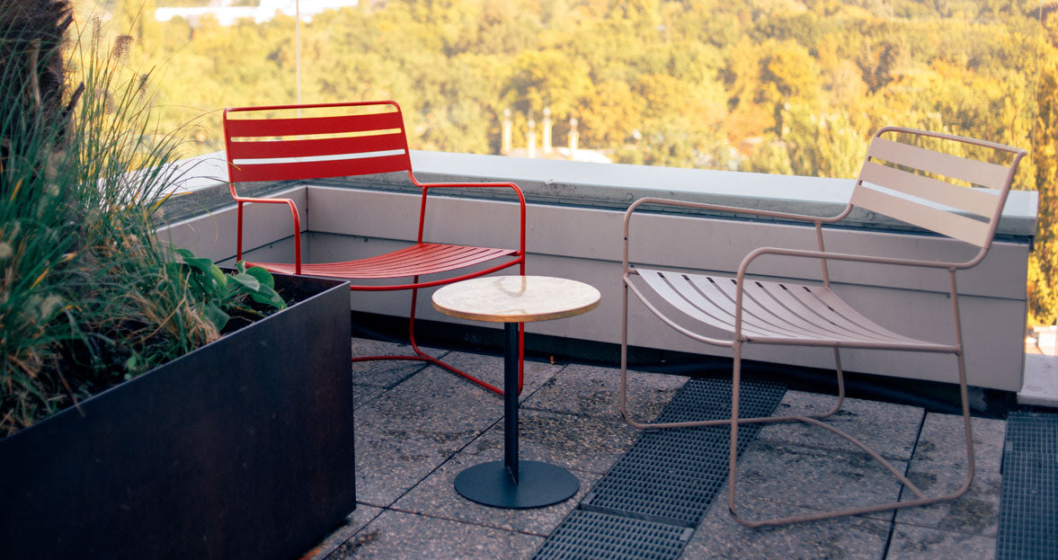 Surprising Low Armchair by Fermob, showing angle view of armchair in the live shot.