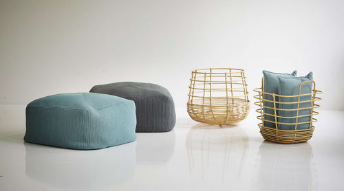 Sweep Rattan Round Basket by Cane-Line, showing sweep rattan round basket with ottomans & square basket in live shot.