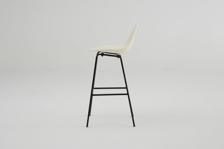 TA Bar Stool Black Base by Toou, showing side view of ta bar stool black base in cream seat/no seat pad.