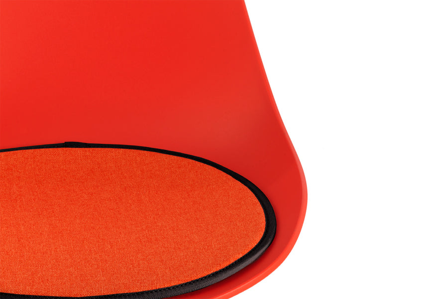 TA Side Chair Er Black Base by Toou, showing closeup view of ta side chair er chrome base in red seat with red seat pad.