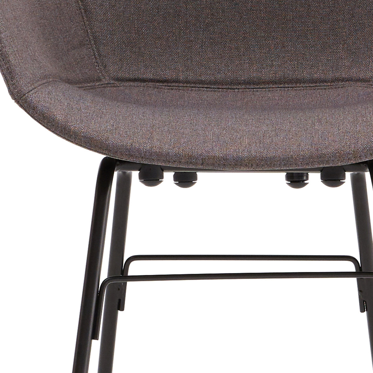 TA Upholstered Armchair by Toou, showing closeup view of ta upholstered armchair er in black base/dark grey shell seat.