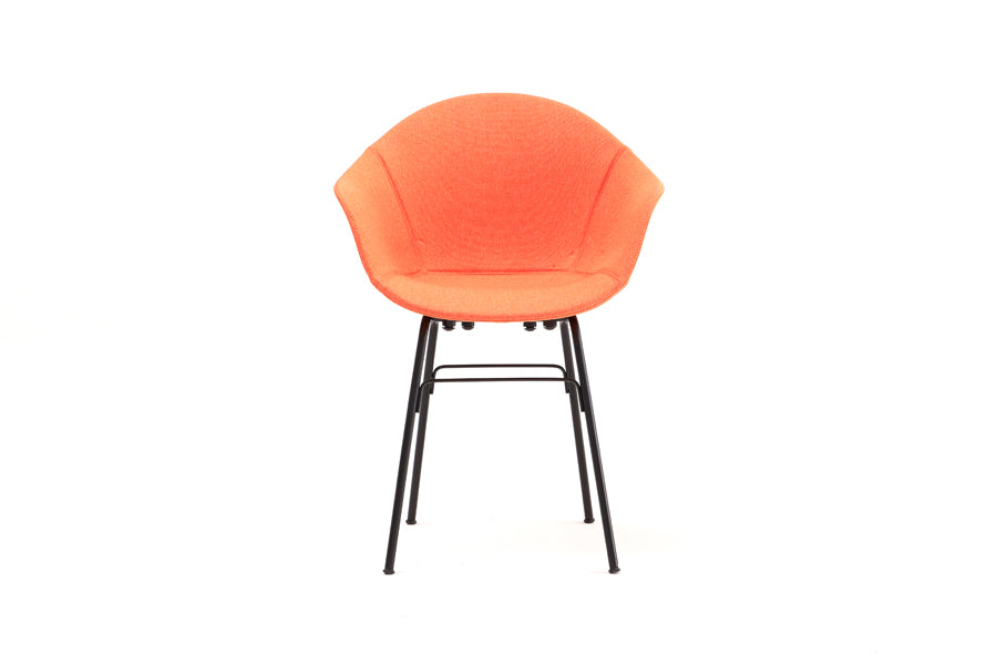 TA Upholstered Armchair by Toou, showing front view of ta upholstered armchair er in black base/red shell seat.