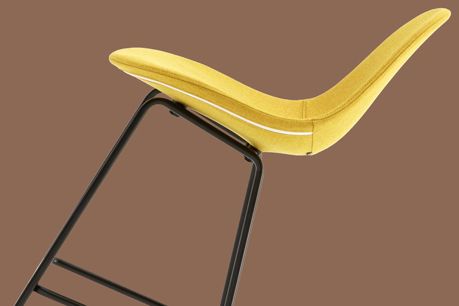 TA XL Upholstered Stool by Toou, showing ta xl upholstered stool in live shot.