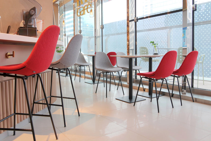 TA XL Upholstered Stool by Toou, showing ta xl upholstered stools in live shot.