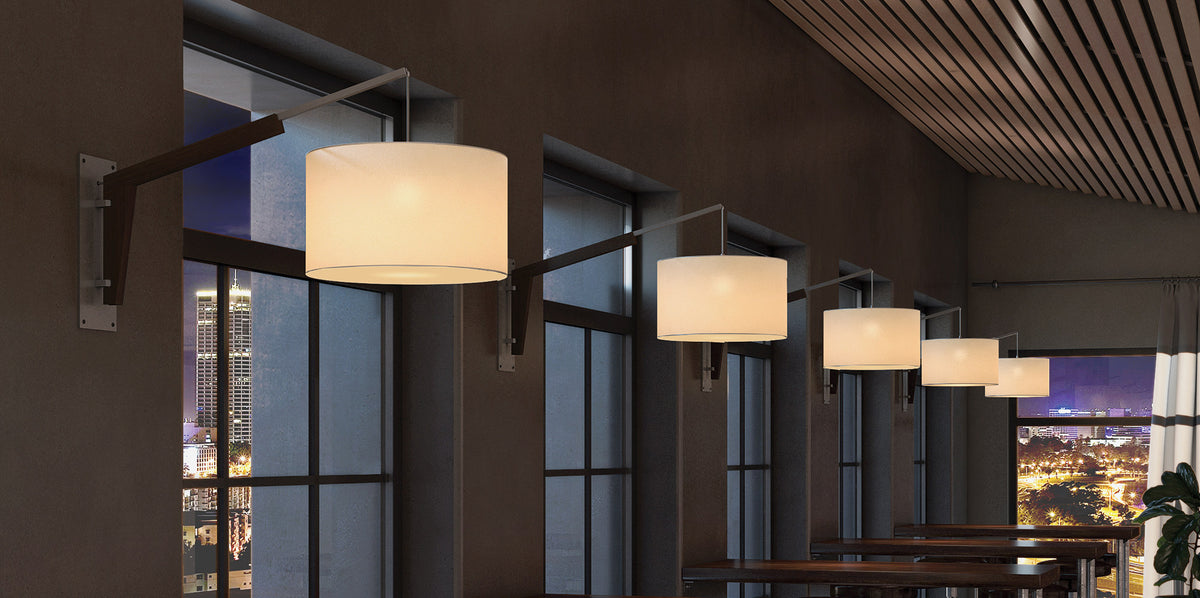 Talea Sconce by Cerno, showing talea sconces with table & chairs in live shot.