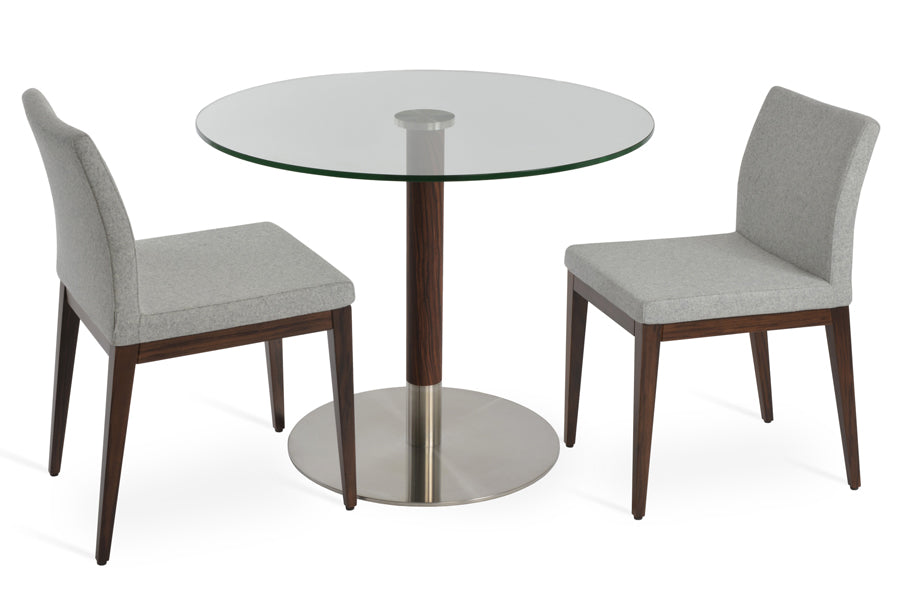 Tango Dining Table by SohoConcept, showing tango dining table with chairs.